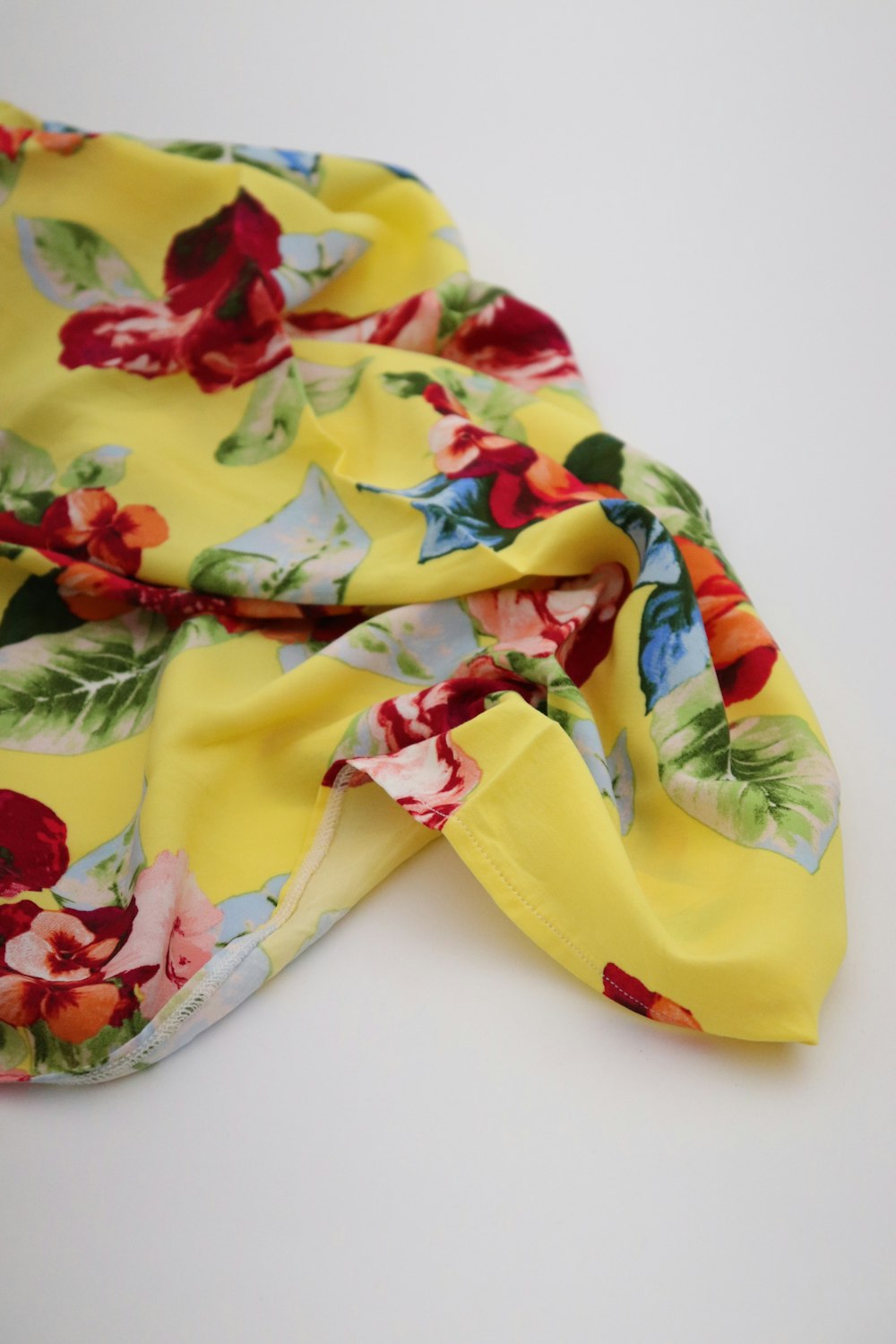 yellow red and green floral textile