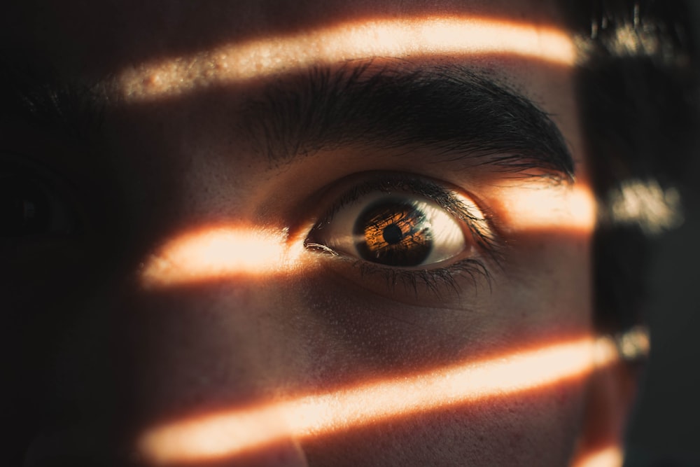 persons eye in close up photography