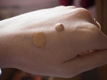 Close-up of smooth, radiant foundation swatched on skin.