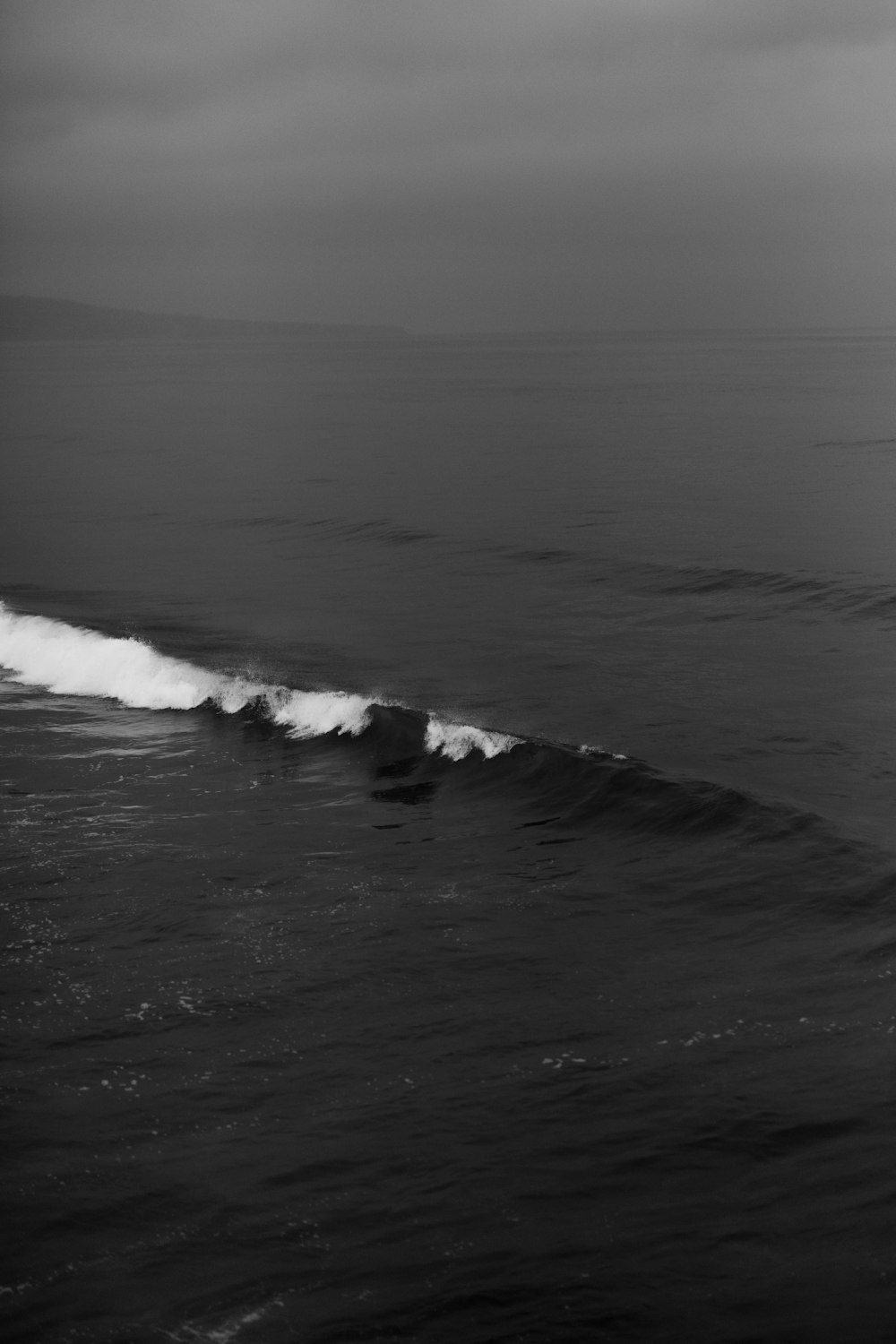 grayscale photo of ocean waves