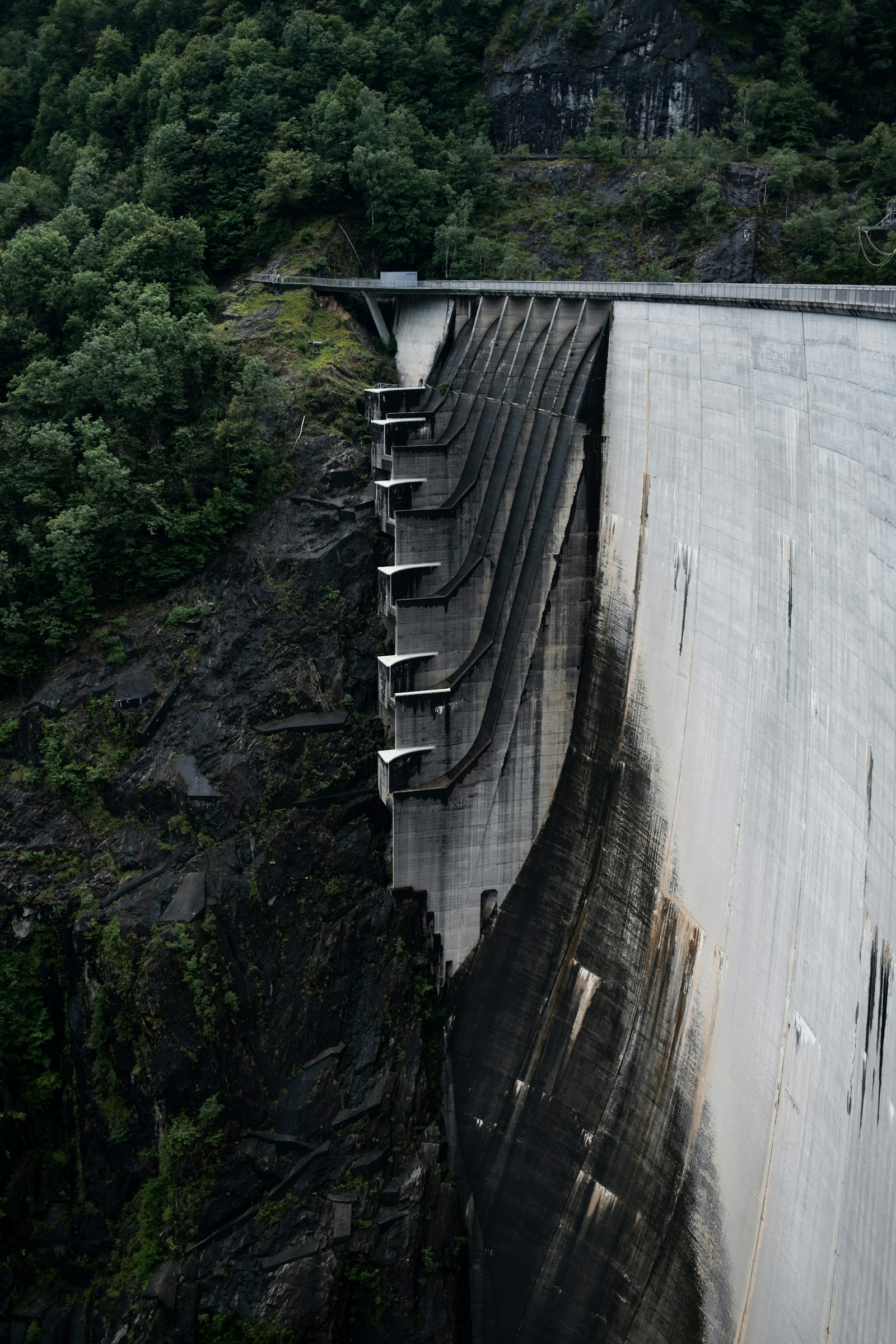 Fujifilm X100V sample photo. Gray concrete dam during photography