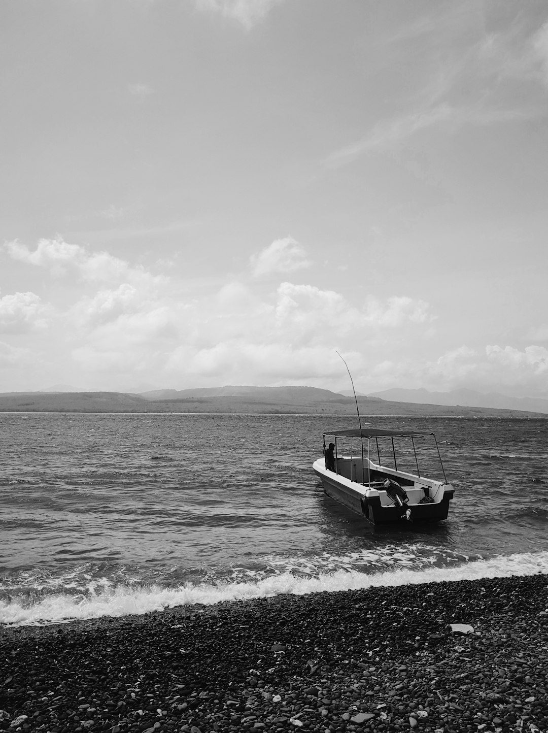 grayscale photo of boat on sea