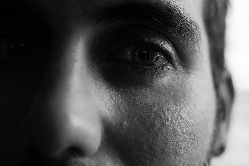 grayscale photo of persons eyes