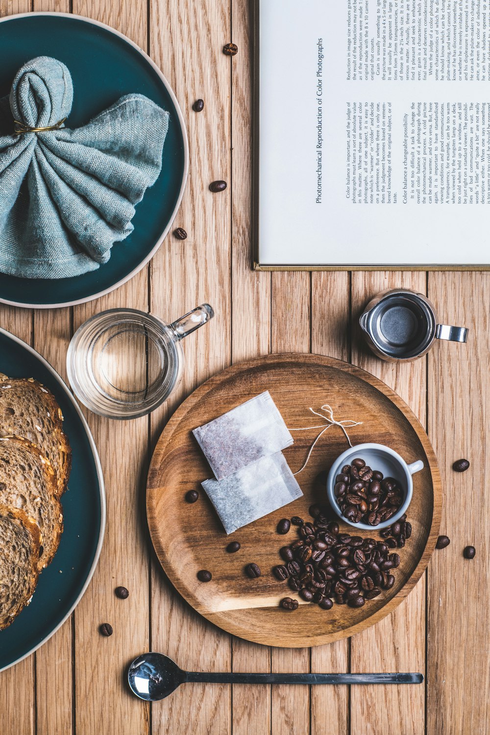 brown wooden round plate with brown and black food on brown wooden table