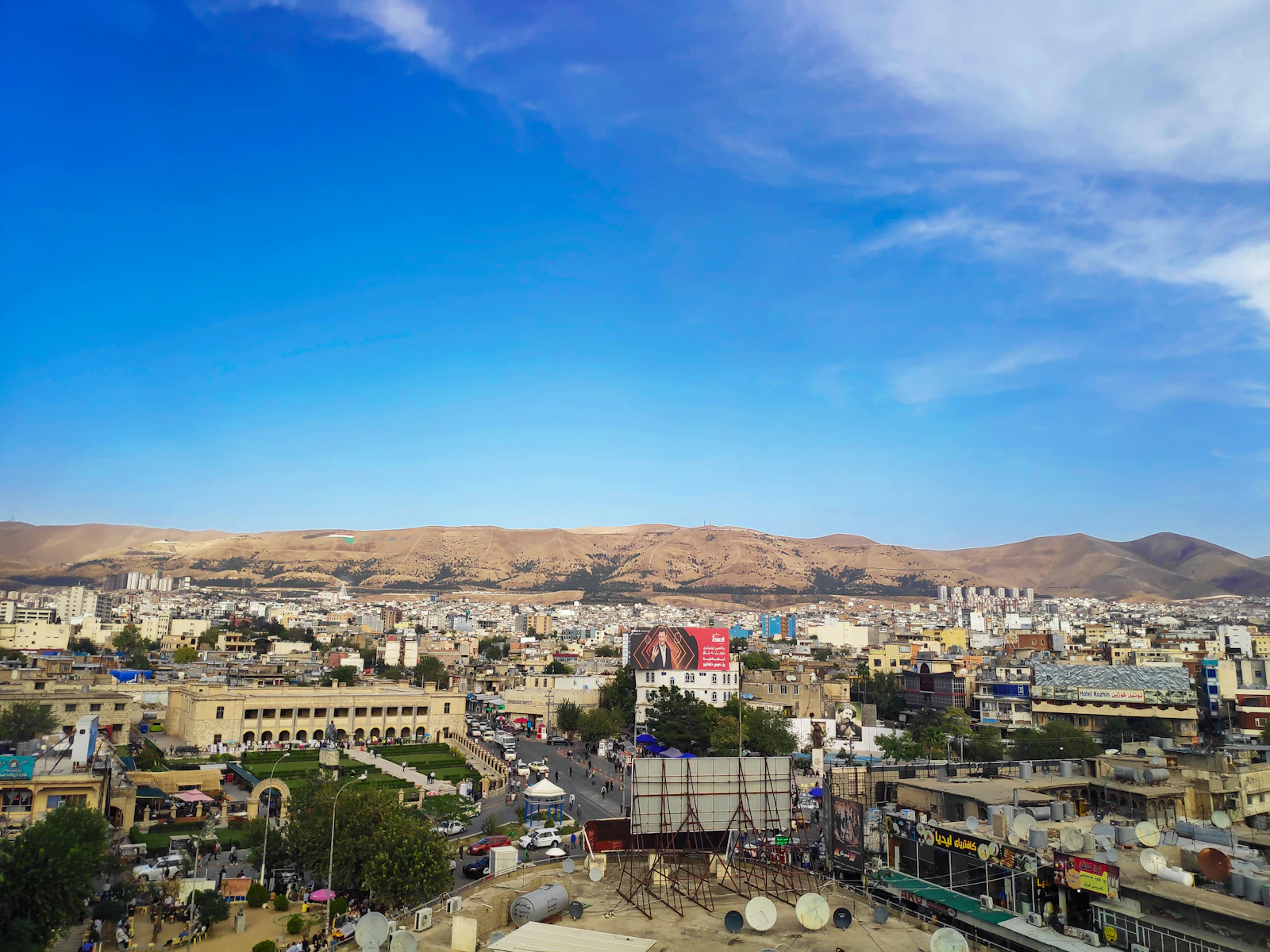 Sulaymaniyah spread across its valley under a blue sky