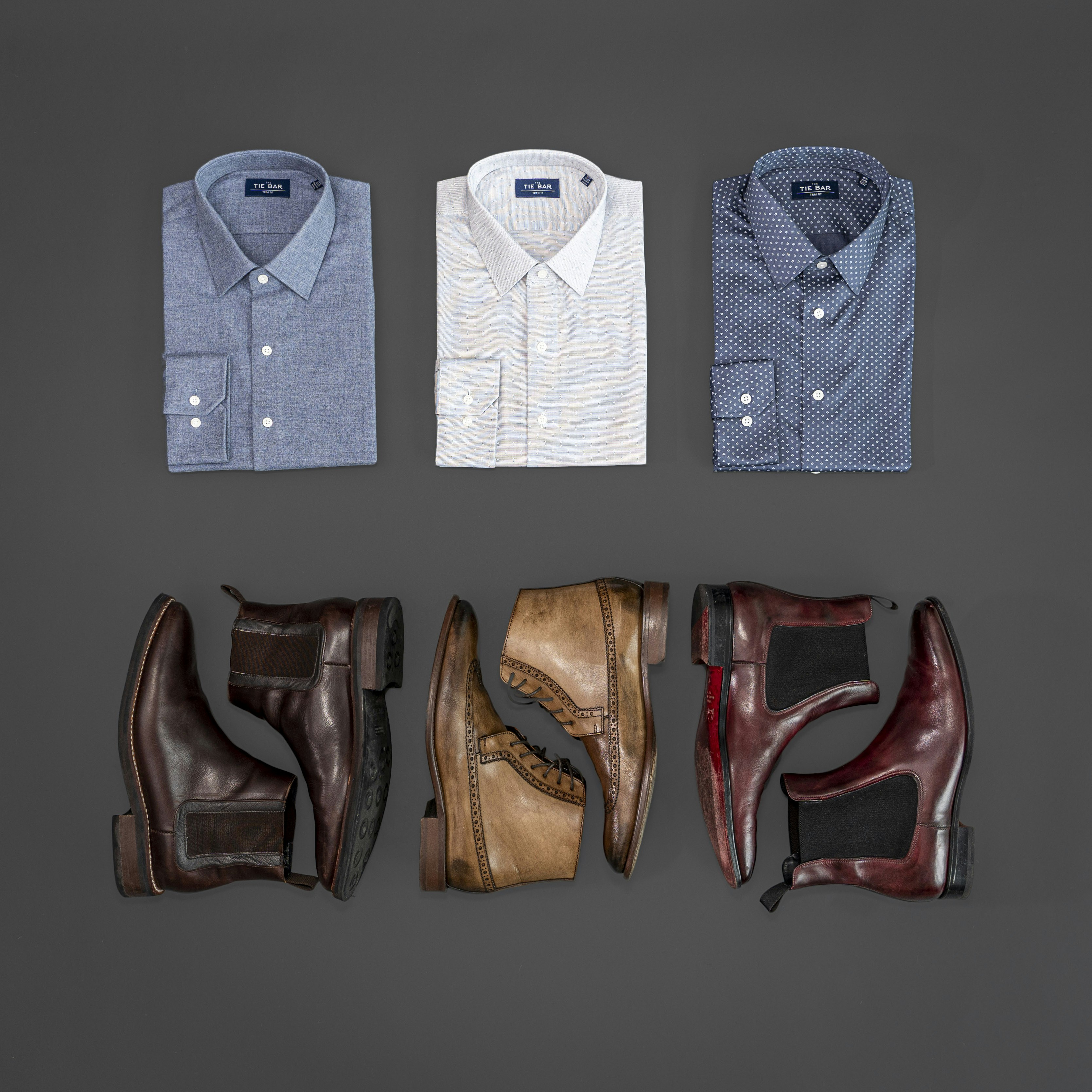 A neatly folded dress shirt showcasing the detail of a double-button barrel cuff