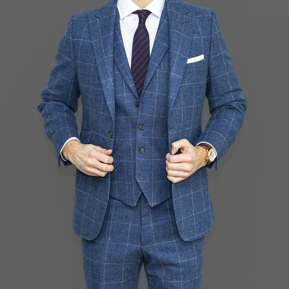 man in blue suit jacket