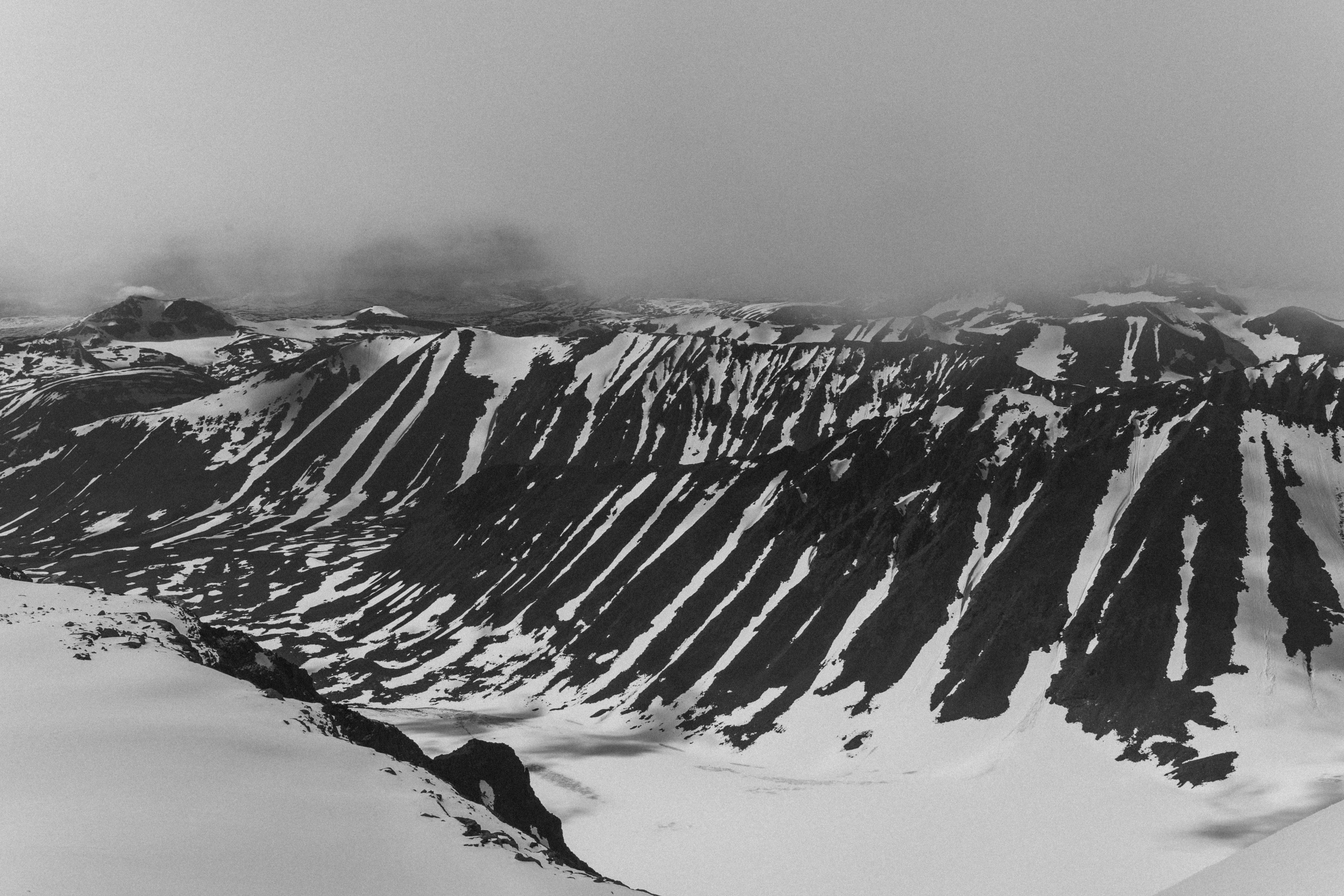 snow covered mountain during daytime