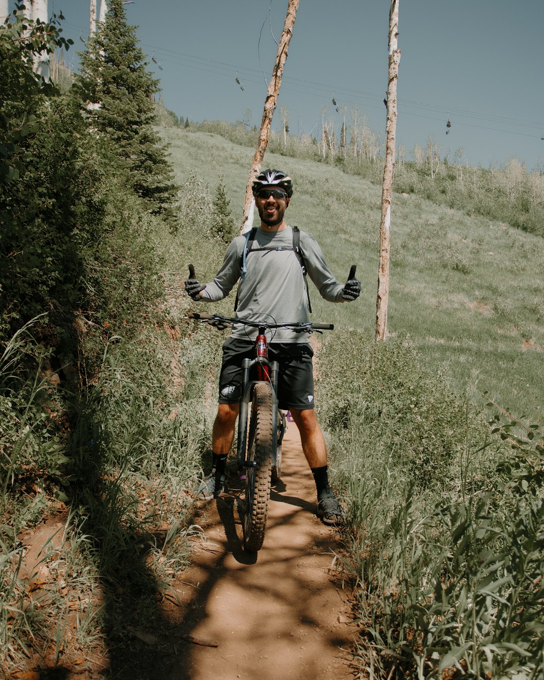 man riding on red motocross dirt bike