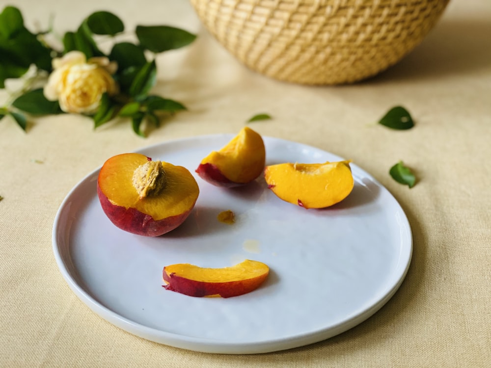 sliced fruits on white ceramic plate