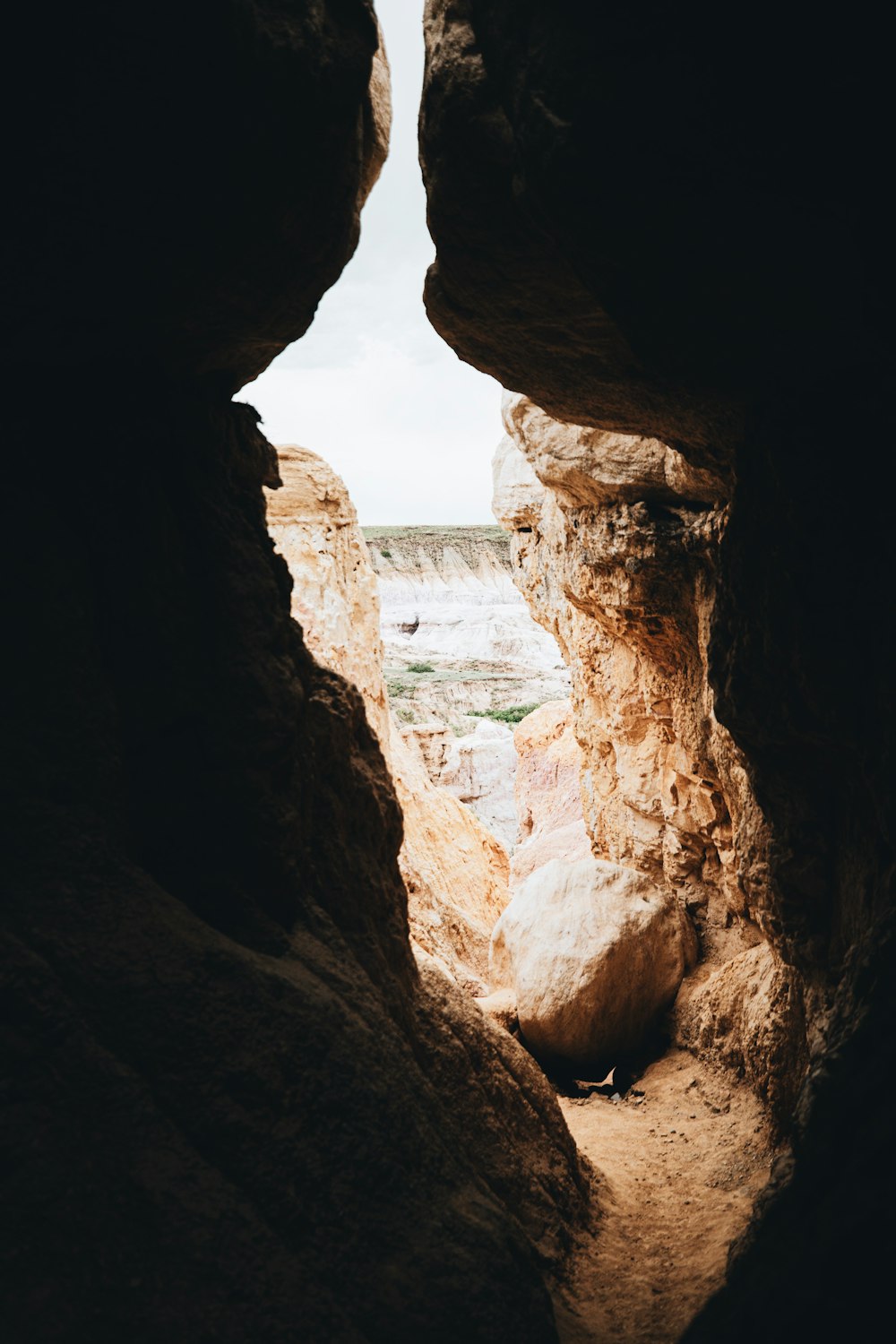 brown rock formation near body of water during daytime