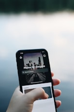 person holding black iphone 7
