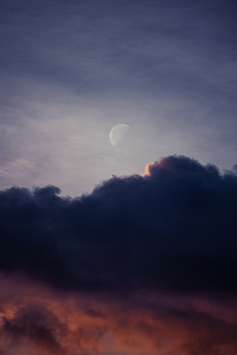 full moon covered by clouds