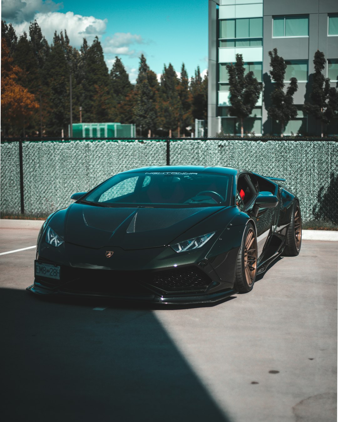 black porsche 911 parked on road during daytime