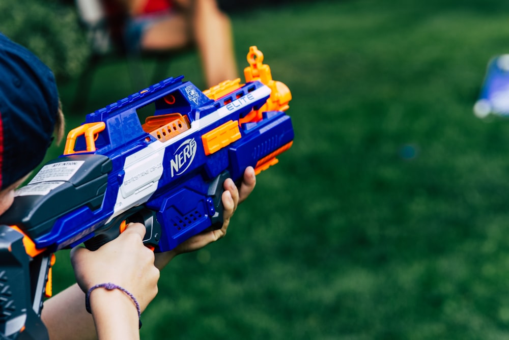 blue and yellow nerf gun