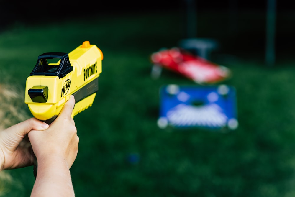 yellow and black plastic toy car