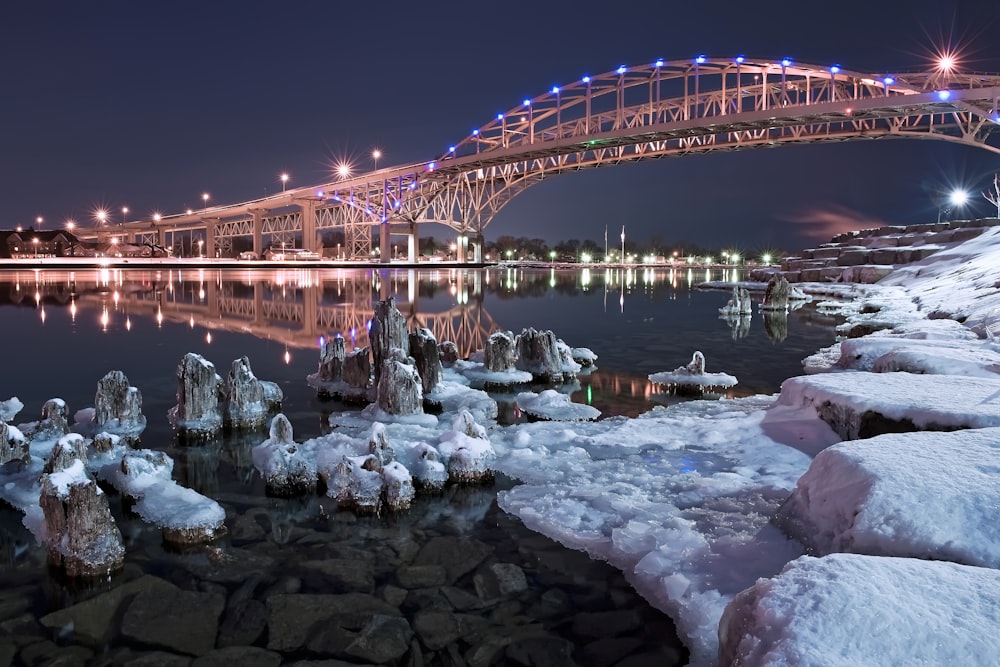 brown bridge over river during night time