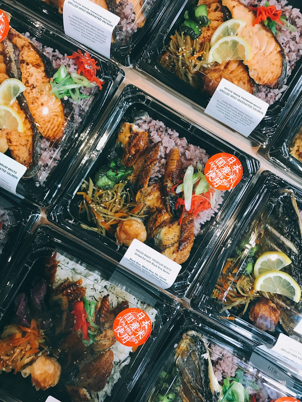 assorted cooked food on black plastic container