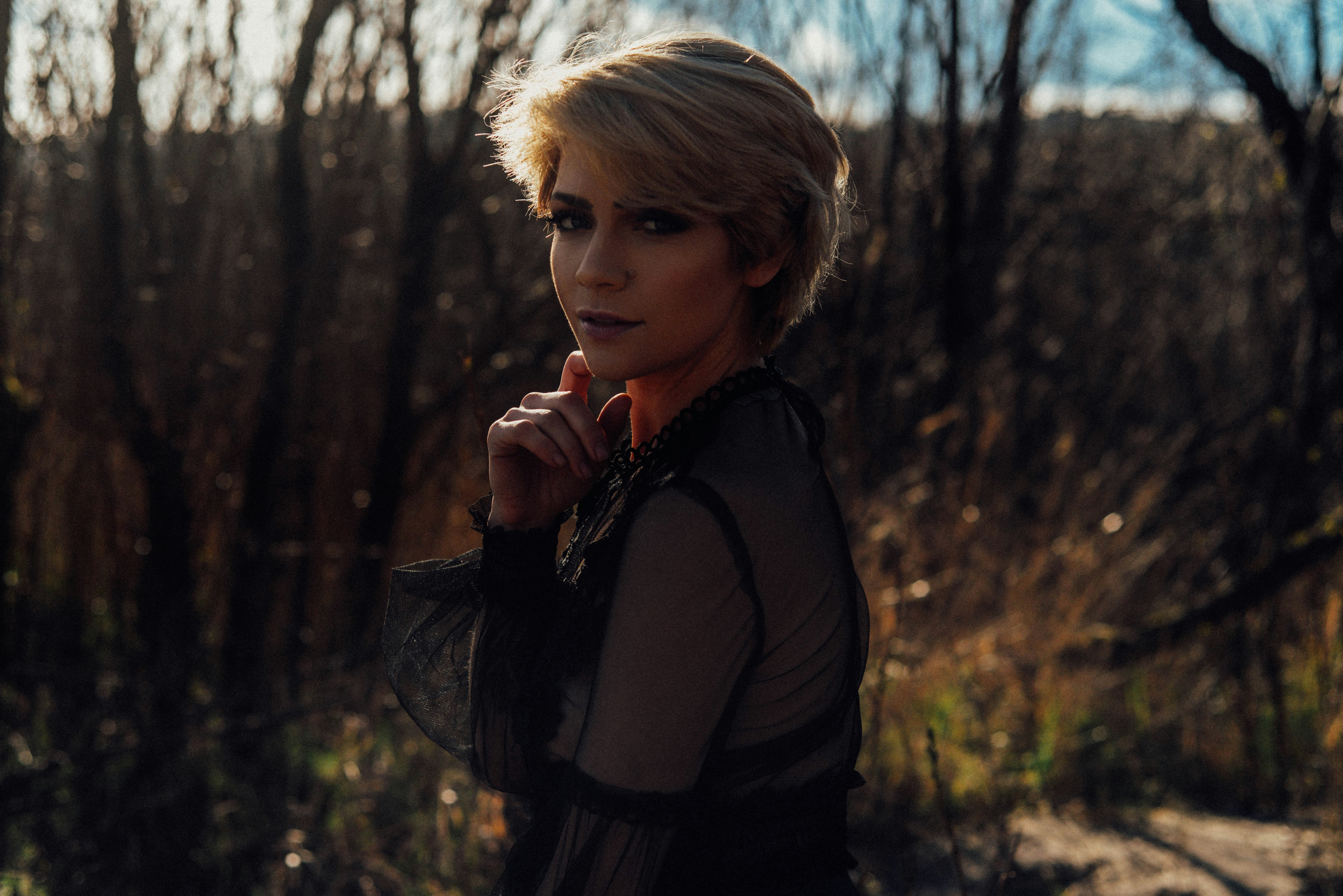 Woman in black jacket standing near trees during daytime photo – Free ...