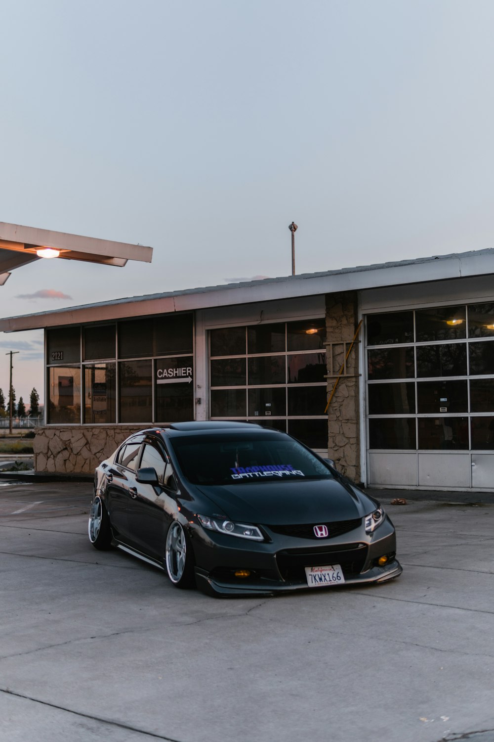 black bmw m 3 parked on parking lot during daytime