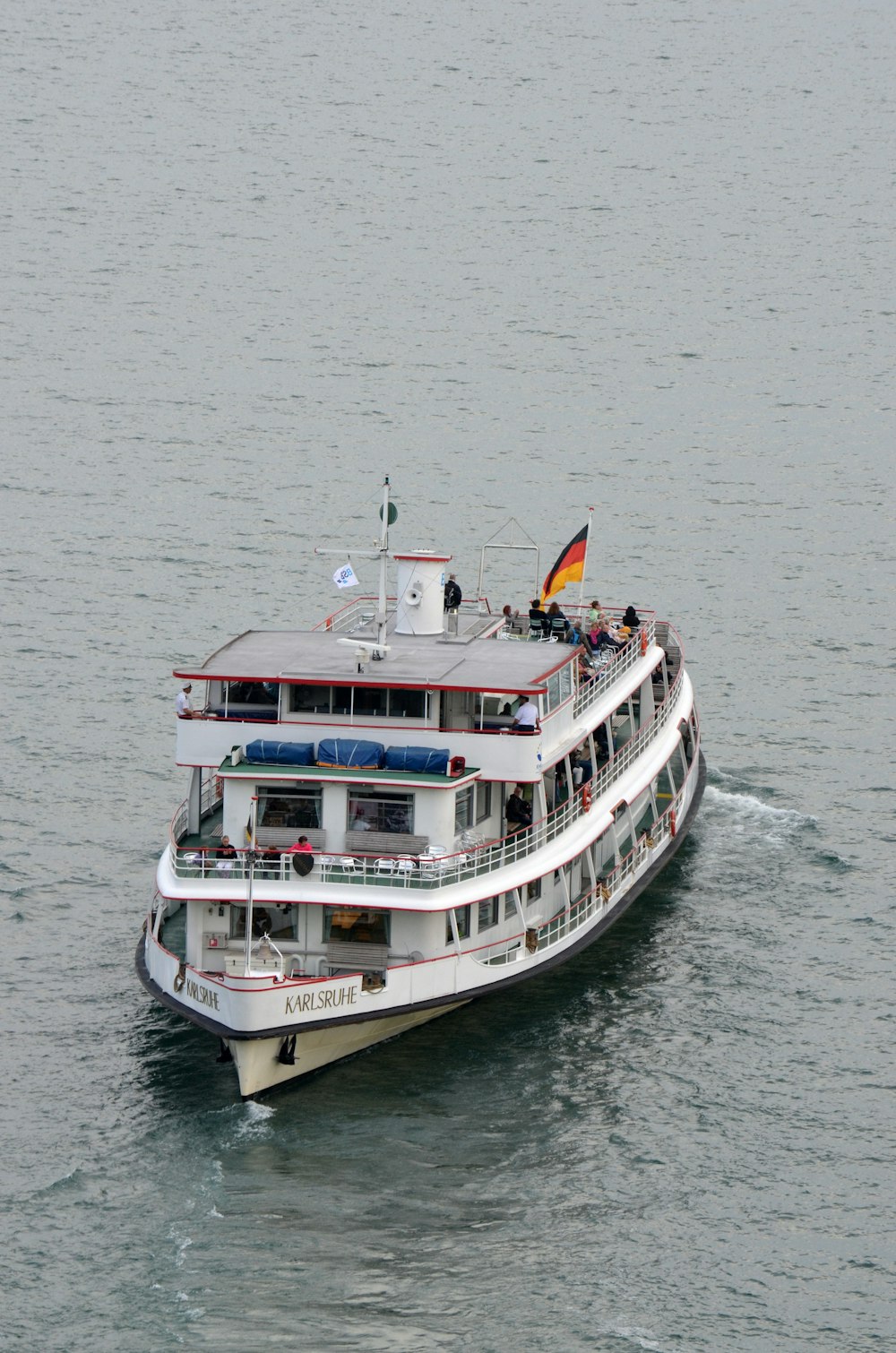 white and blue ship on sea during daytime