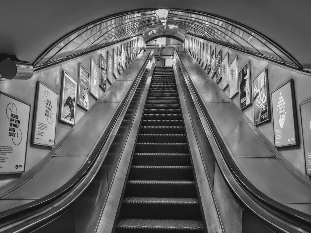 grayscale photo of a escalator