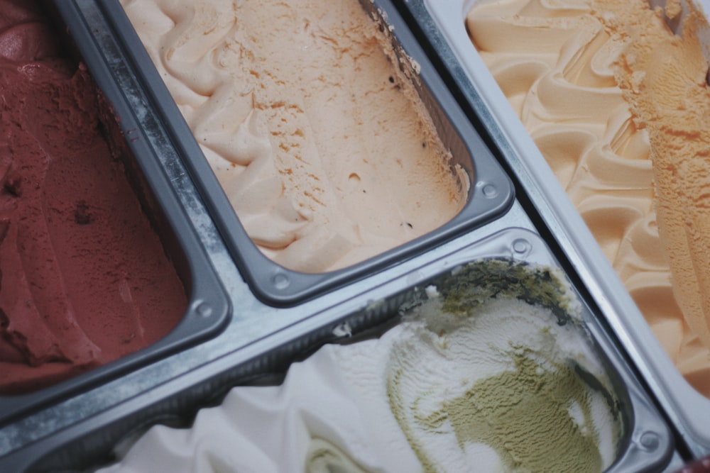 white ice cream in black plastic container