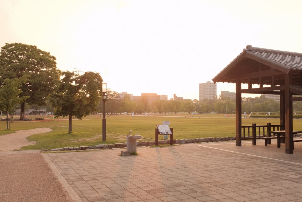 man and woman sitting on bench near body of water during daytime