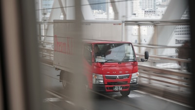 red and white truck on michelin light truck tyres sold at the tyrepublic tire shop 