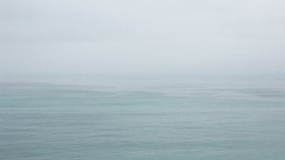 body of water under white sky during daytime cote d'ivoire google meet background