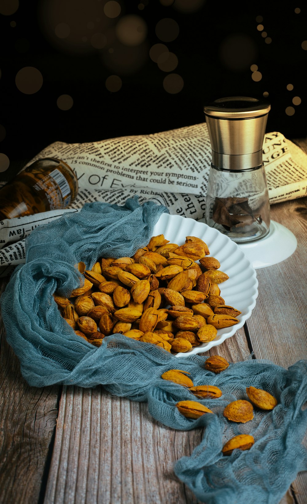 brown peanuts on white ceramic plate