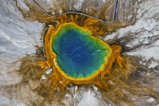 blue and yellow water on brown and gray surface