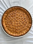 brown pie on white textile