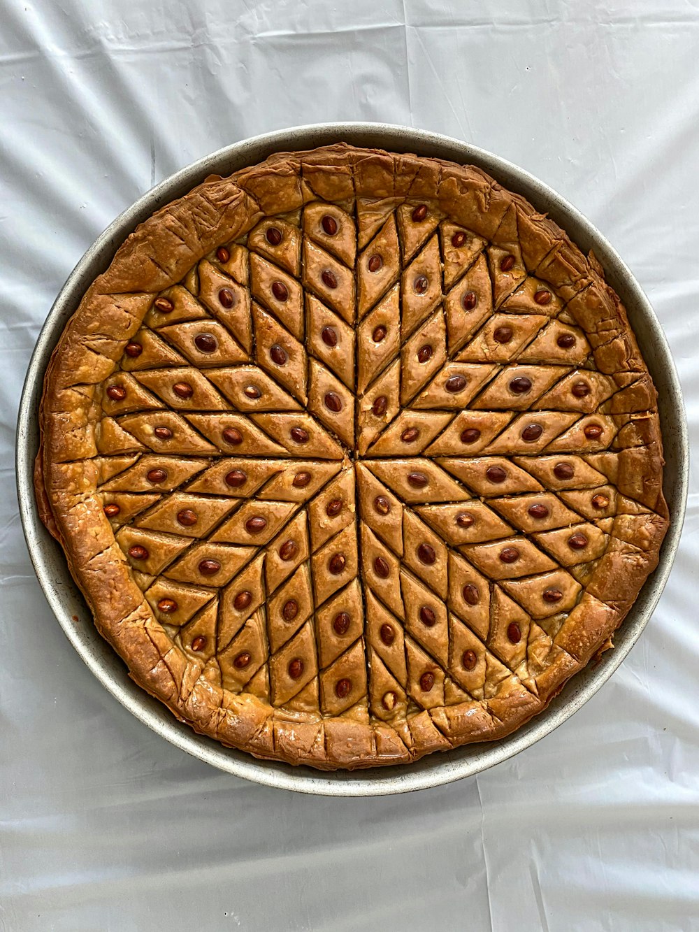 brown pie on white textile