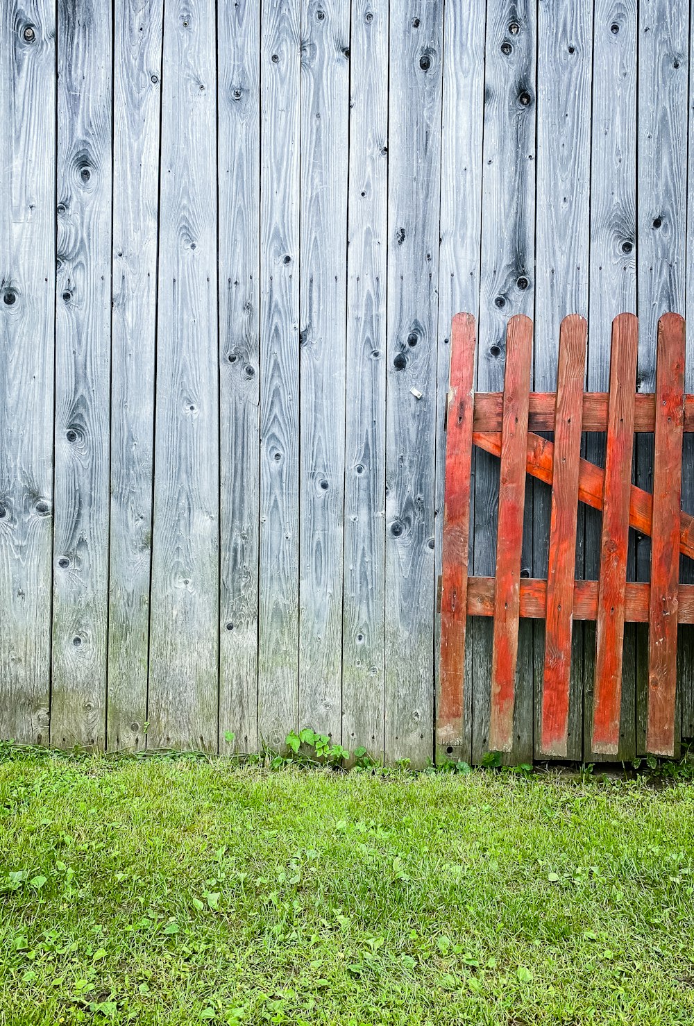 brown wooden fence on green grass field