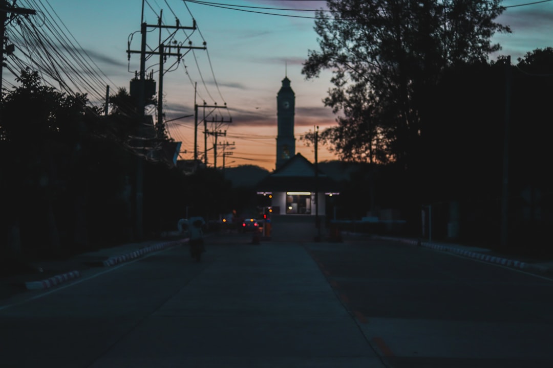 cars parked on side of the road during sunset