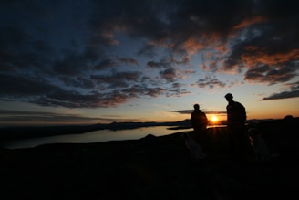 A serene sunset backdrop with individuals reflecting and connecting.