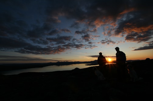 A serene sunset backdrop with individuals reflecting and connecting.