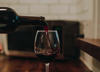 clear wine glass on brown wooden table