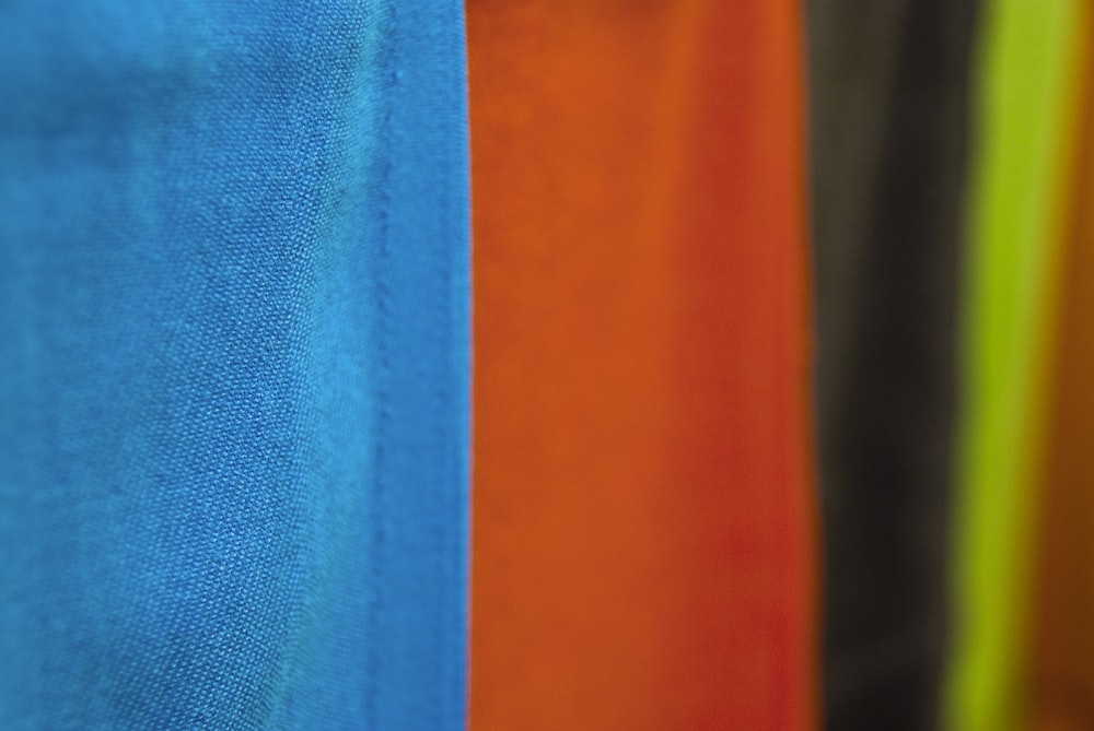 orange blue and white textile