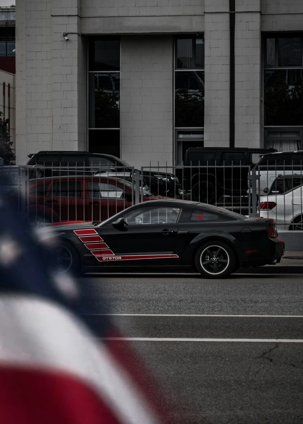 black and red coupe on road