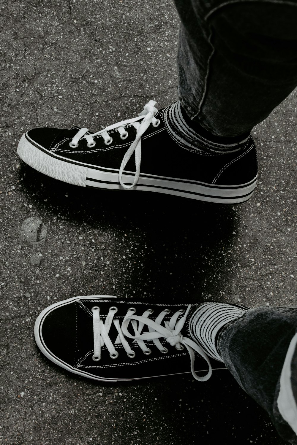 person wearing black and white vans low top sneakers photo – Free United  states Image on Unsplash