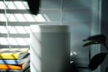 gray and black speaker on white table