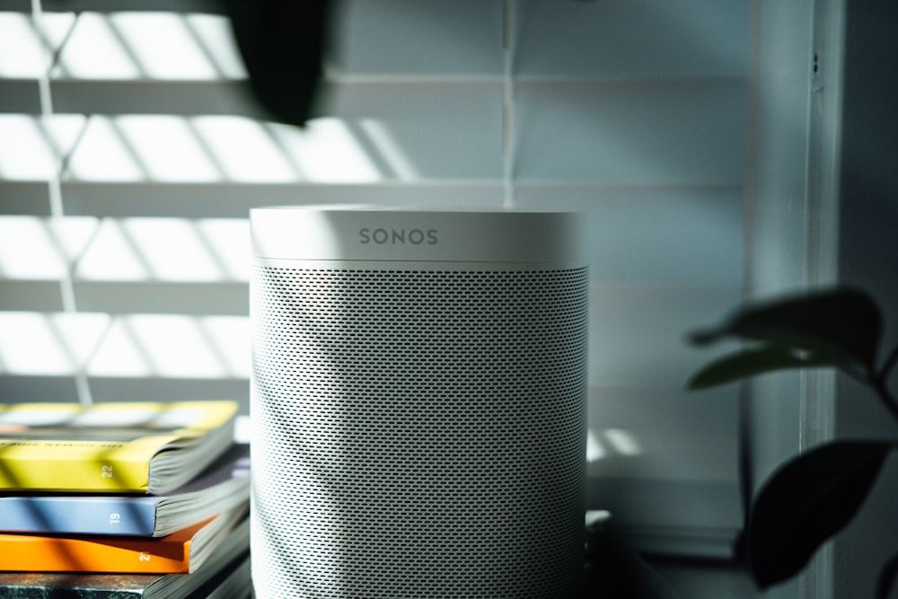 gray and black speaker on white table