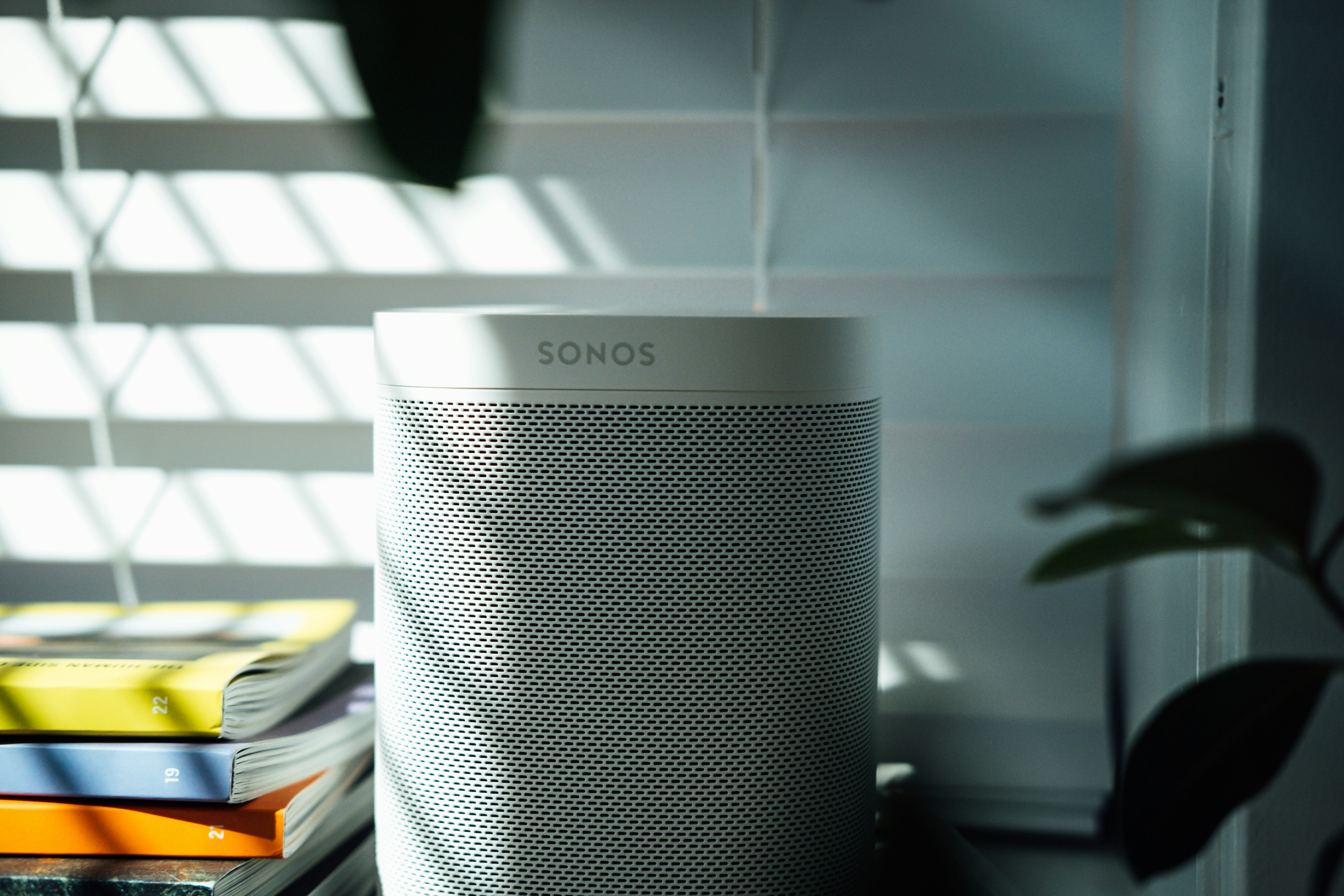 gray and black speaker on white table