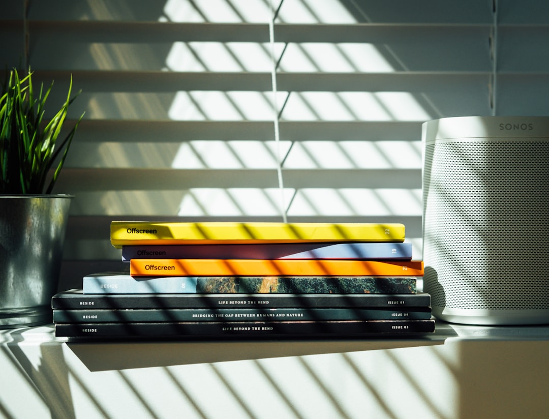 black and yellow books on white shelf