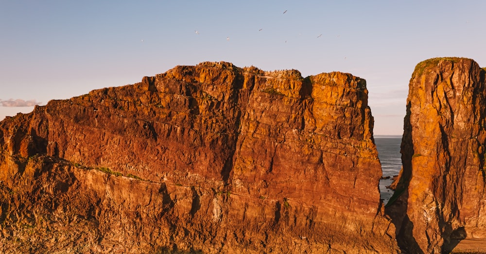 brown rock formation under blue sky during daytime