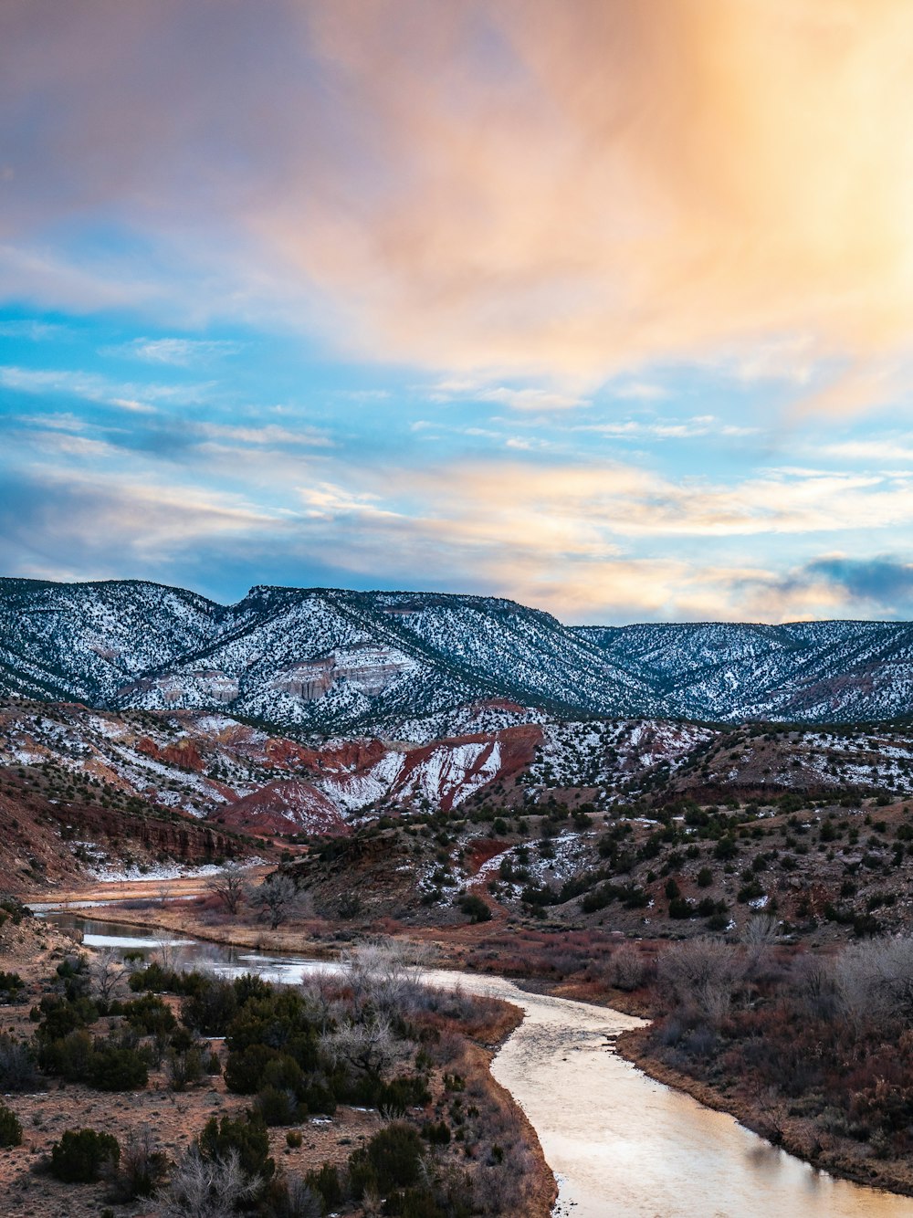 brown mountains under white clouds during daytime