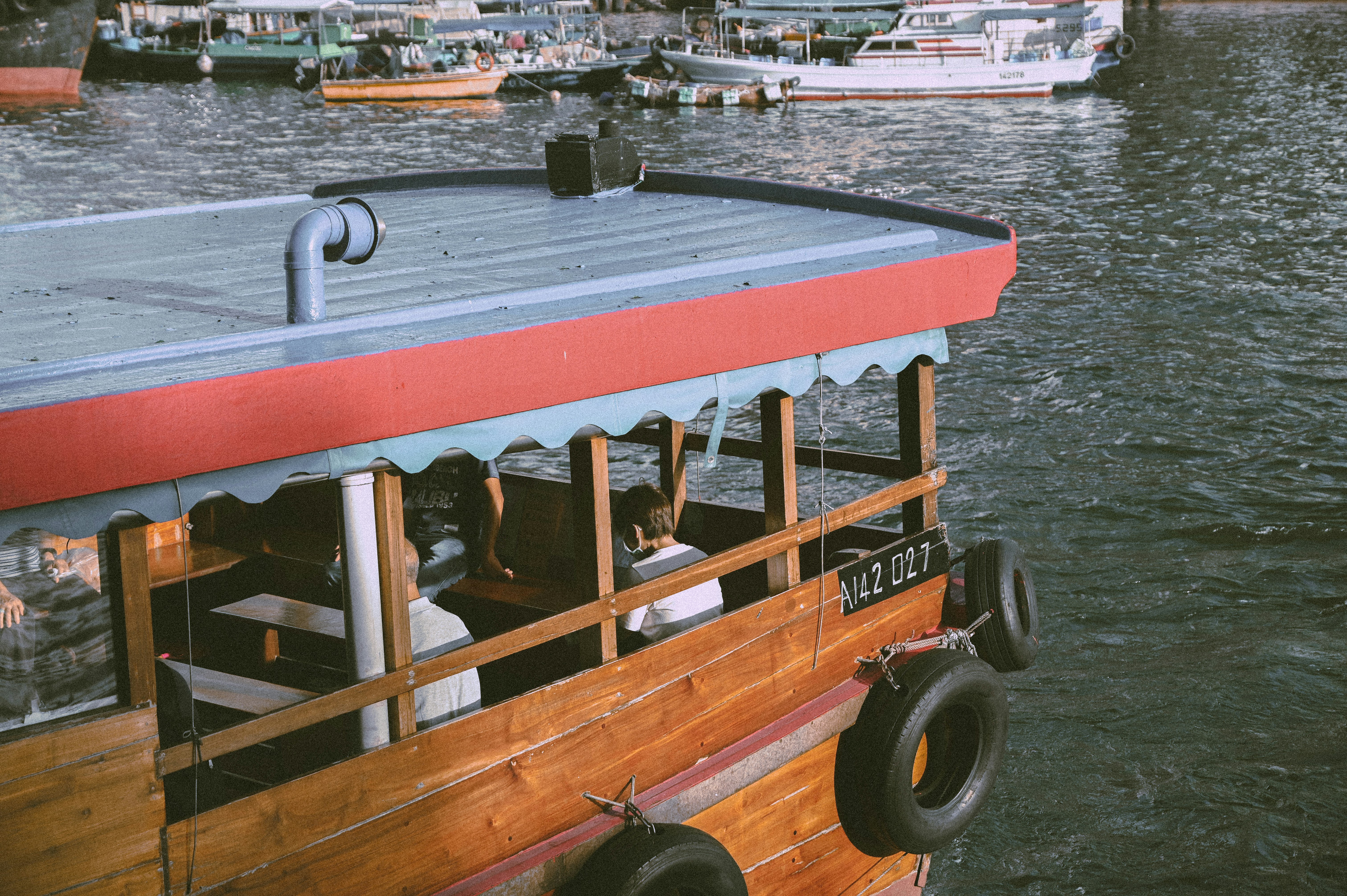 brown and black boat on body of water during daytime