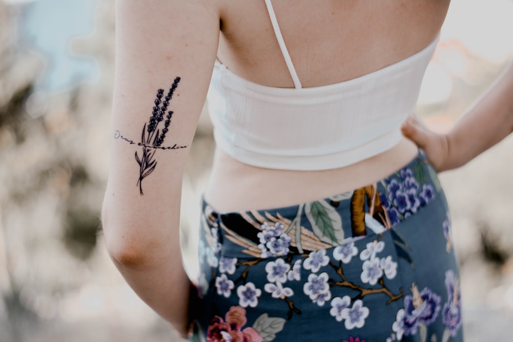 woman in white brassiere and floral skirt